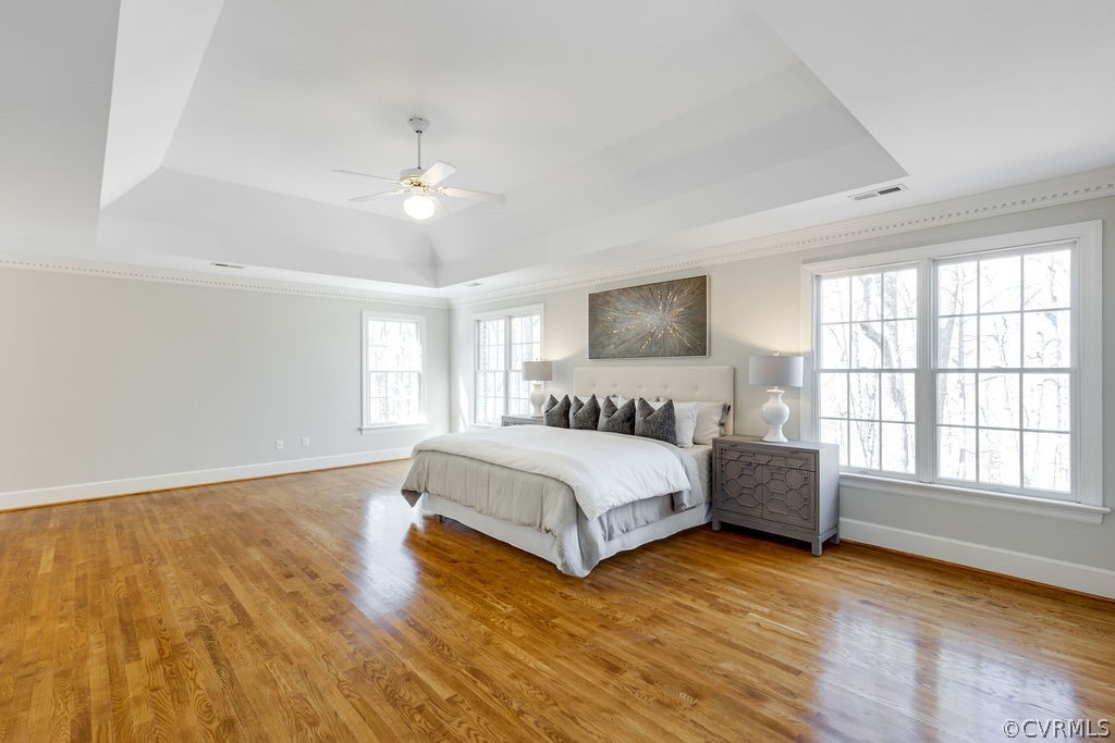 11902 Reeds Bluff Lane Midlothian, VA 23113 - Photo 26 of 42 a spacious bedroom with a large bed and a window