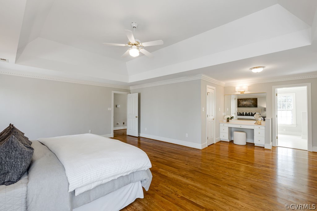 11902 Reeds Bluff Lane Midlothian, VA 23113 - Photo 28 of 42 a bedroom with a bed and a chandelier