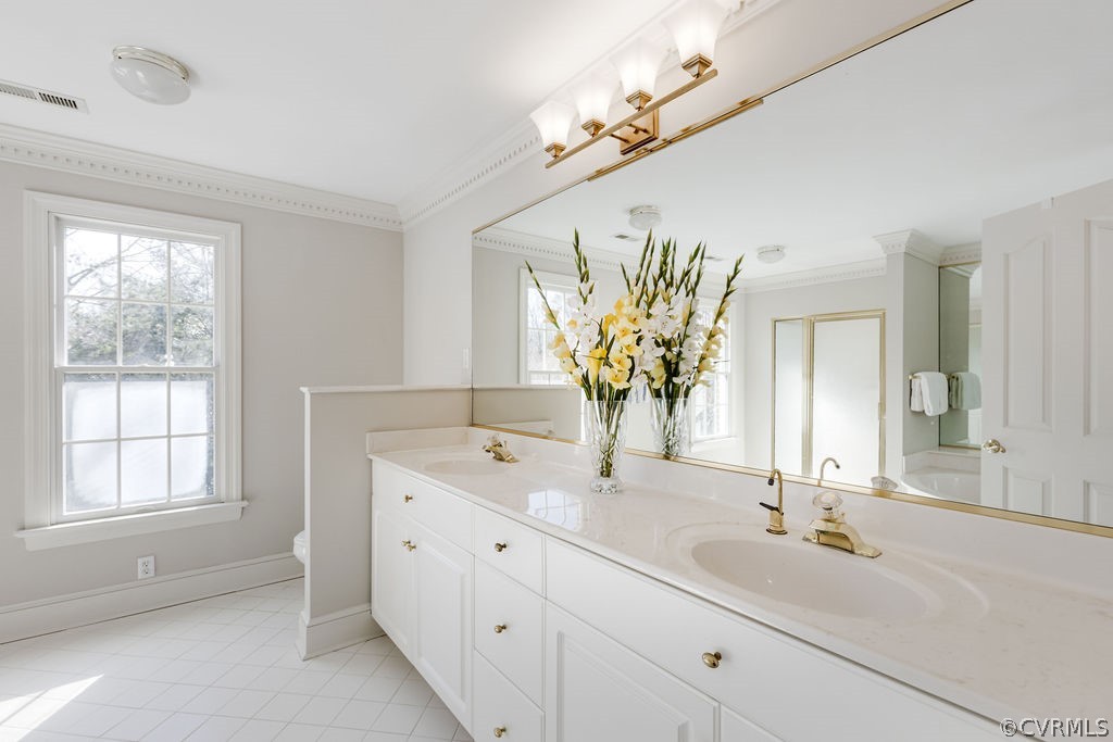 11902 Reeds Bluff Lane Midlothian, VA 23113 - Photo 30 of 42 a bathroom with a double vanity sink and a mirror