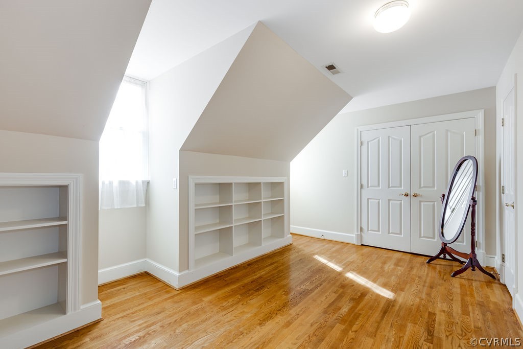 11902 Reeds Bluff Lane Midlothian, VA 23113 - Photo 32 of 42 a view of an empty room with wooden floor and a window