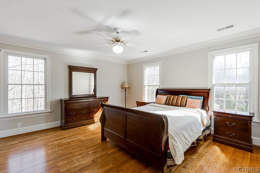 11902 Reeds Bluff Lane Midlothian, VA 23113 - Photo 33 of 42 a bedroom with a bed and wooden floor