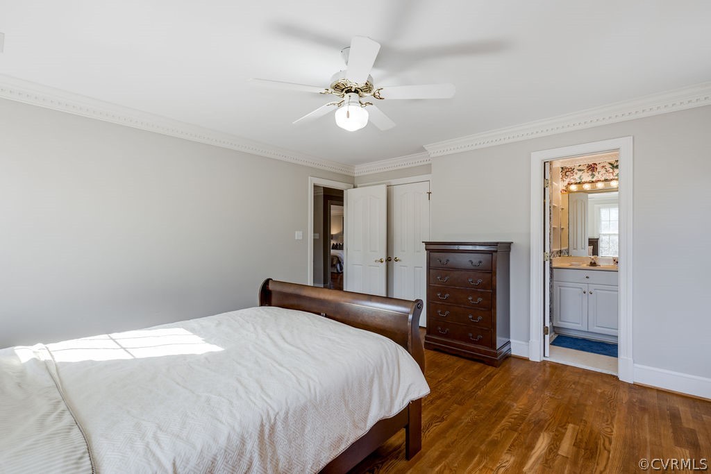 11902 Reeds Bluff Lane Midlothian, VA 23113 - Photo 34 of 42 a bedroom with a bed and a chandelier