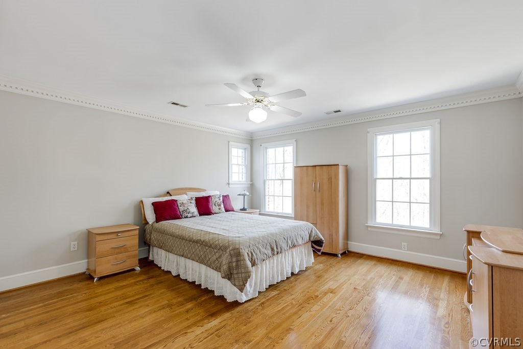 11902 Reeds Bluff Lane Midlothian, VA 23113 - Photo 36 of 42 a bedroom with a bed and wooden floor