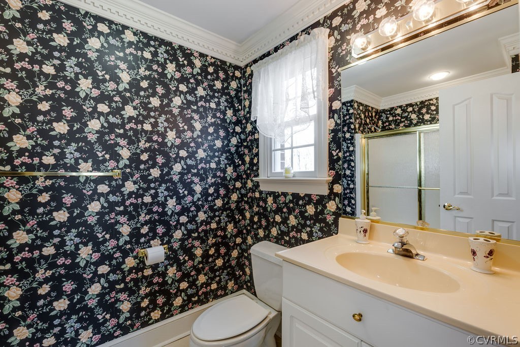 11902 Reeds Bluff Lane Midlothian, VA 23113 - Photo 37 of 42 a bathroom with a sink toilet and mirror