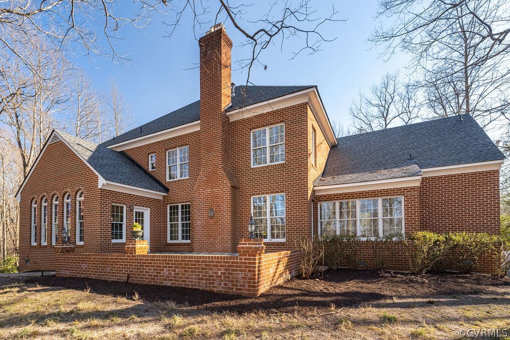 11902 Reeds Bluff Lane Midlothian, VA 23113 - Photo 40 of 42 a front view of a house with yard