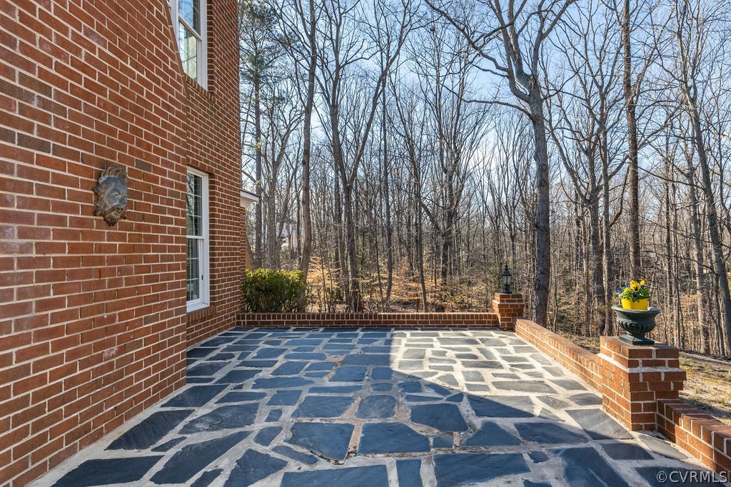 11902 Reeds Bluff Lane Midlothian, VA 23113 - Photo 41 of 42 a view of a brick wall with many windows