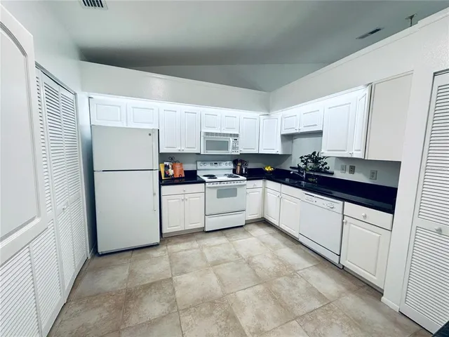 a view of a livingroom with wooden floor