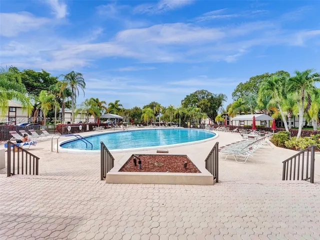 a view of a swimming pool with a patio