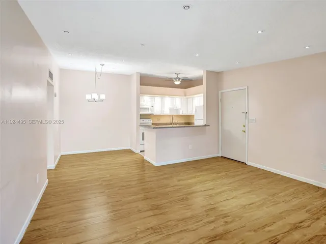 a view of a kitchen with a dishwasher and a refrigerator