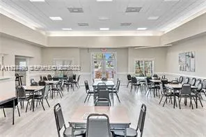 a view of a table and chairs under an umbrella