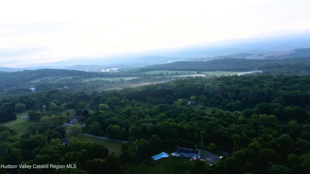 an aerial view of residential house and outdoor space