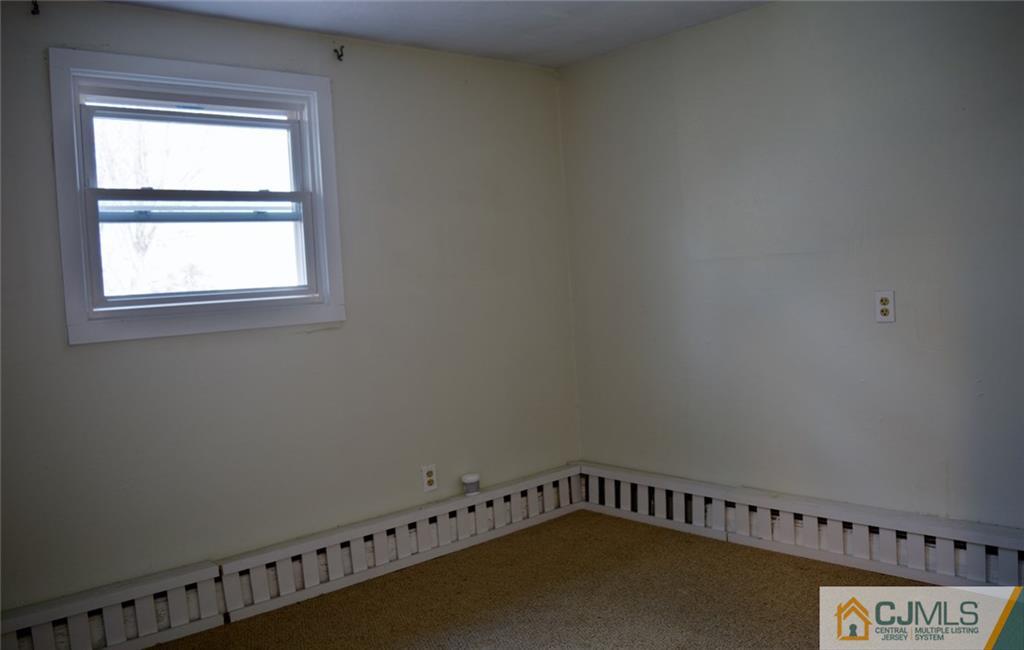 292 Georges Road Dayton, NJ 08810 - Photo 12 of 19 a view of a room with rack on the wall
