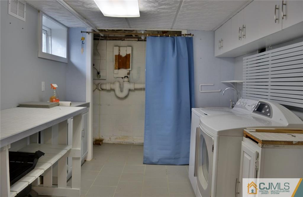 292 Georges Road Dayton, NJ 08810 - Photo 15 of 19 a bathroom with a sink a toilet and shower