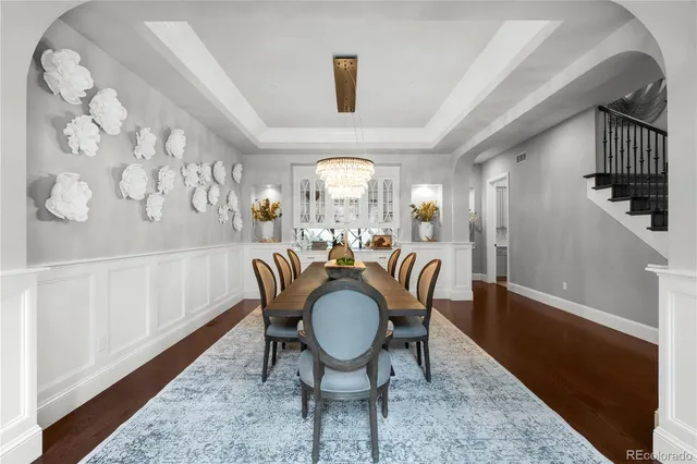 a view of hallway with furniture and wooden floor