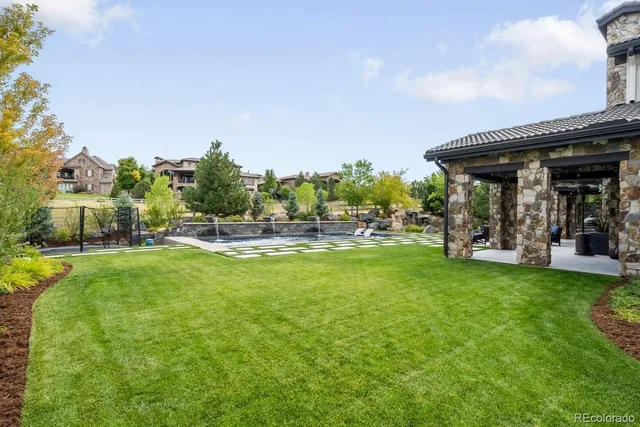 a view of house with swimming pool outdoor seating