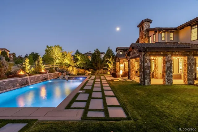 an aerial view of a house with a street