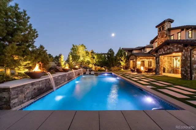a view of a swimming pool with an outdoor seating