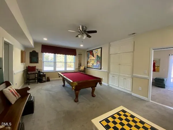a view of a livingroom with furniture and a flat screen tv