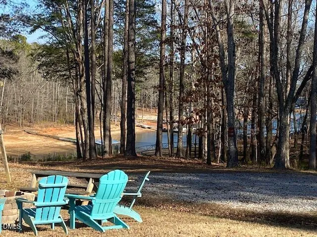 a view of a patio with table and chairs and couches