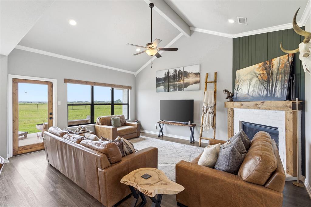 2990 Wilson Road Palmer, TX 75152 - Photo 9 of 40 a living room with furniture fireplace and a large window