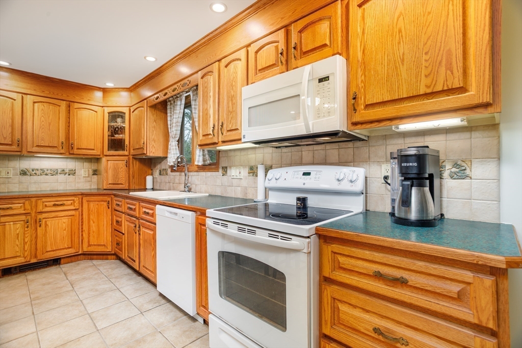 25 Ellis Road Westminster, MA 01473 - Photo 7 of 32 a kitchen with stainless steel appliances granite countertop a sink and cabinets
