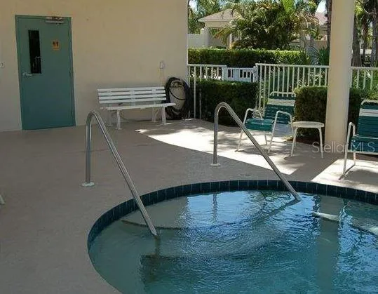 a view of a chairs and table in patio