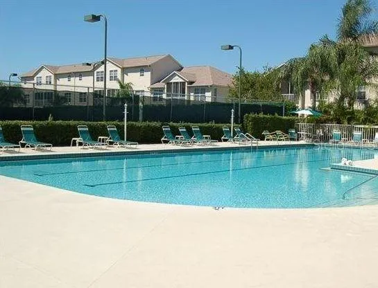 a view of a swimming pool and a chairs