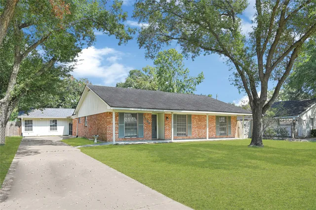 front view of a house with a garden