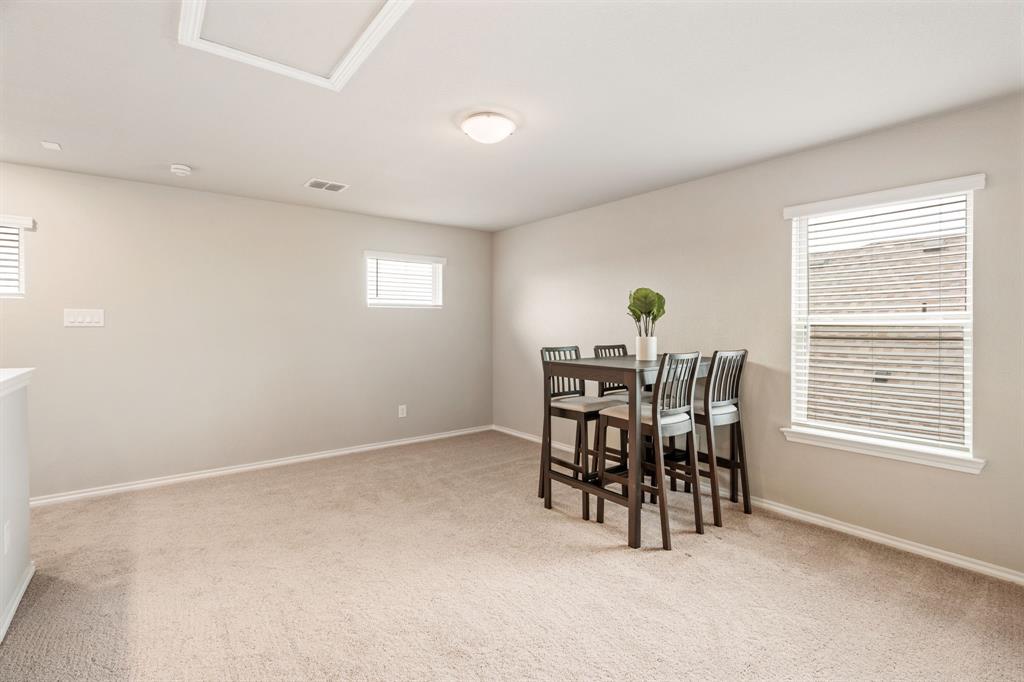 321 Pasture Drive Midlothian, TX 76065 - Photo 23 of 40 a view of a dining room with furniture and chandelier