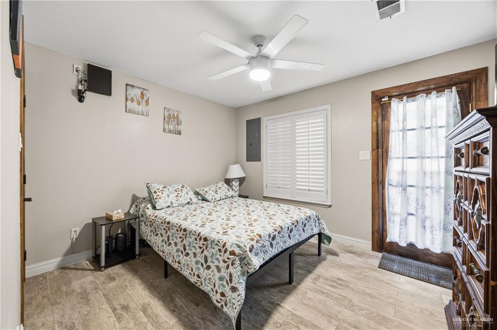 1811 Victoria Street Mission, TX 78572 - Photo 11 of 19 a bedroom with a bed and a large window with the outer view