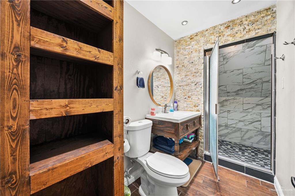 1811 Victoria Street Mission, TX 78572 - Photo 14 of 19 a bathroom with a toilet a sink and a shower