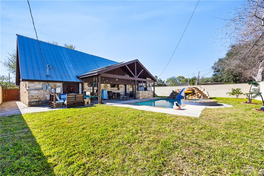 1811 Victoria Street Mission, TX 78572 - Photo 18 of 19 a view of a house with a yard patio and swimming pool