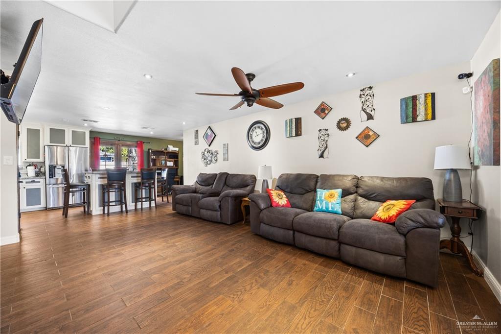 1811 Victoria Street Mission, TX 78572 - Photo 4 of 19 a living room with furniture and wooden floor