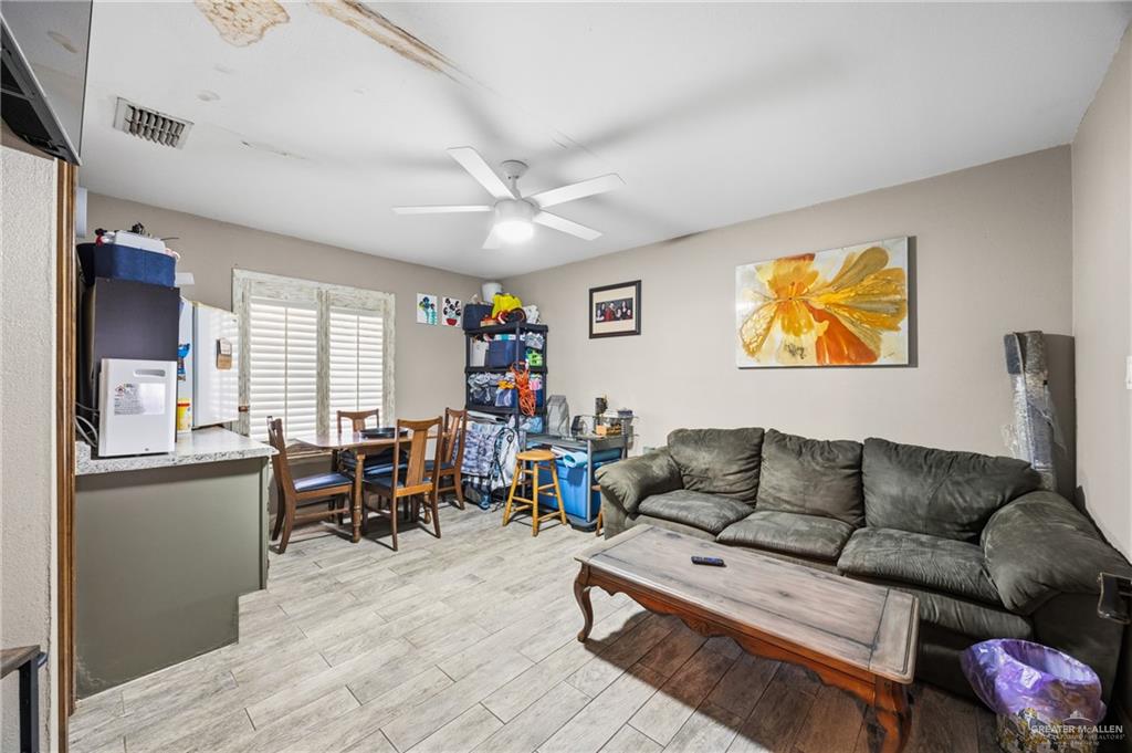 1811 Victoria Street Mission, TX 78572 - Photo 6 of 19 a living room with furniture and a flat screen tv