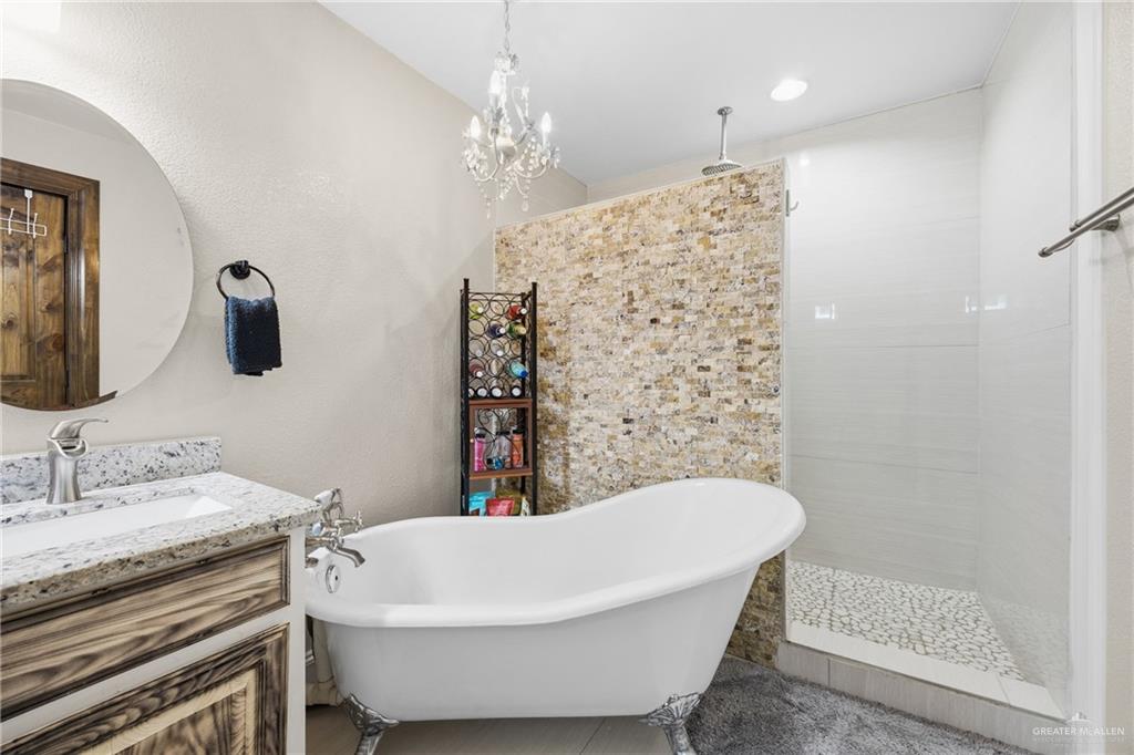 1811 Victoria Street Mission, TX 78572 - Photo 9 of 19 a bathroom with a sink a toilet and shower