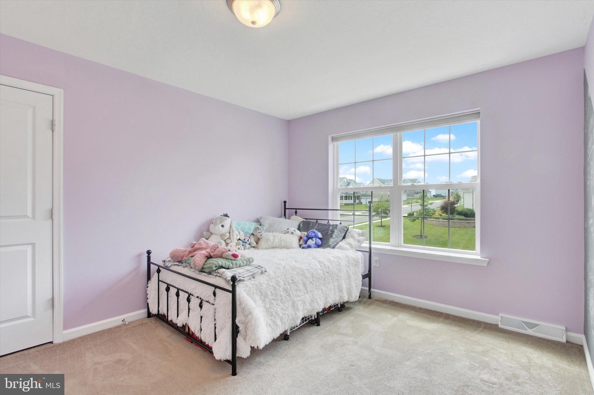 49 Red Rock Run Hanover, PA 17331 - Photo 23 of 38 a bed sitting in a bedroom next to a window