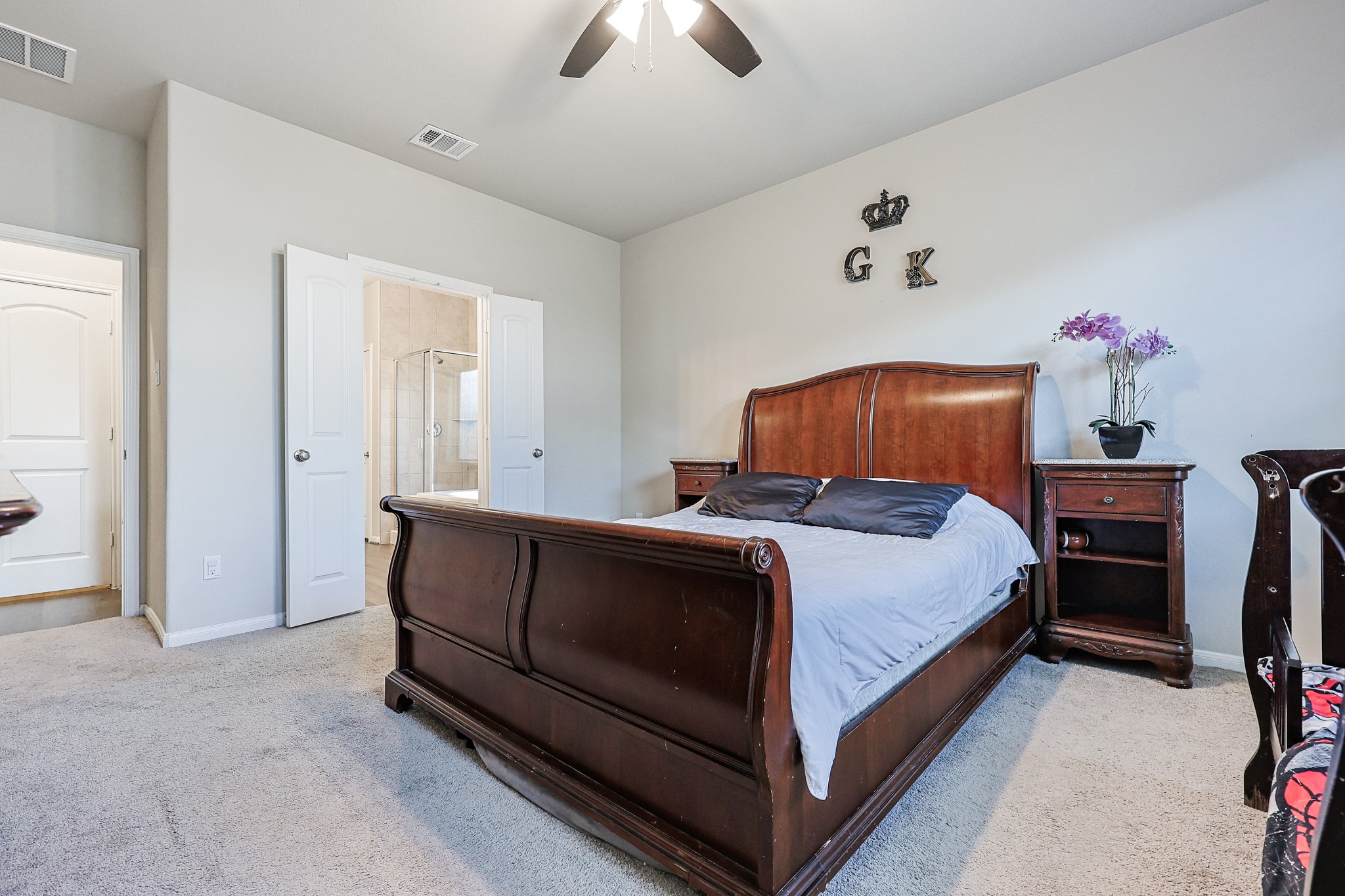 10423 Rochester Hls Lane Tomball, TX 77375 - Photo 17 of 36 Escape to this generously sized primary bedroom suite, designed with relaxation and comfort in mind.