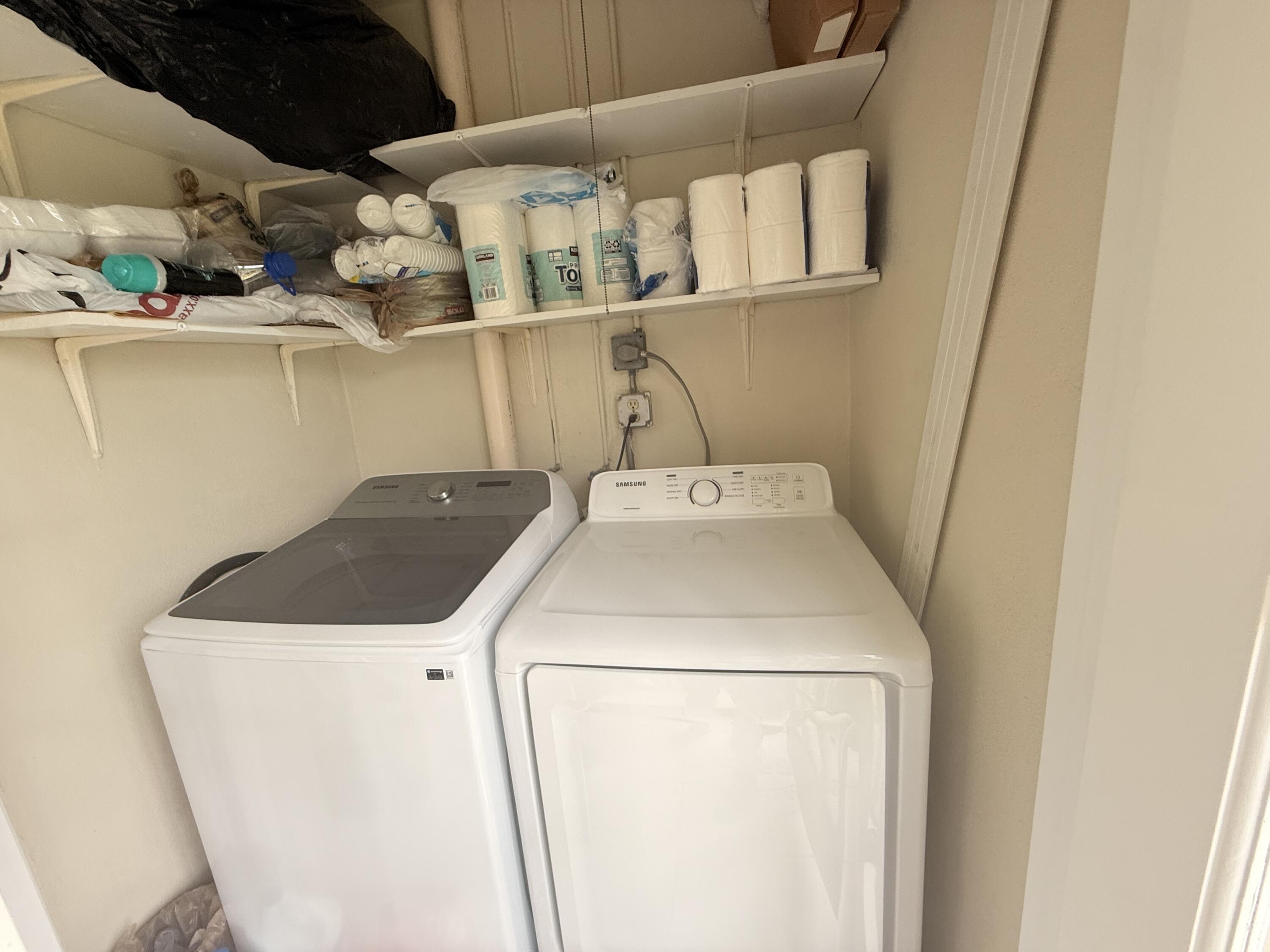906 Southwest 9th St Circle, Unit 204 Boca Raton, FL 33486 - Photo 21 of 39 a utility room with dryer and washer
