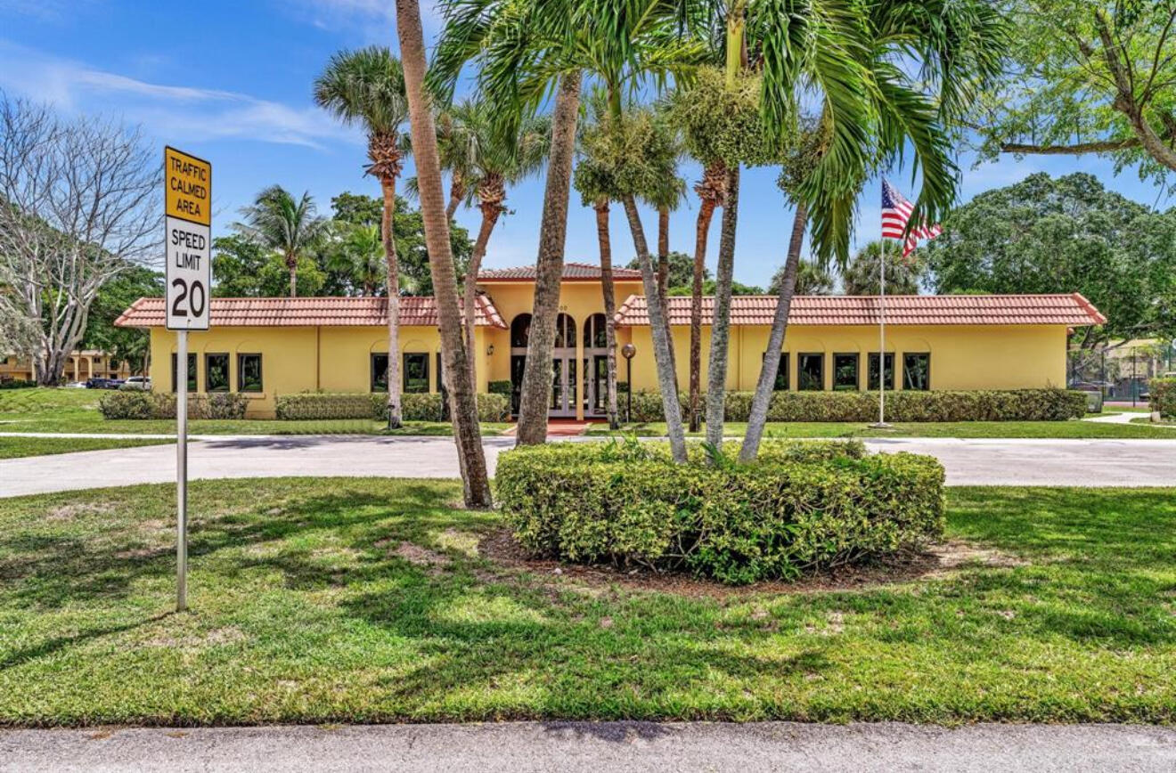 906 Southwest 9th St Circle, Unit 204 Boca Raton, FL 33486 - Photo 33 of 39 a view of a house with a yard