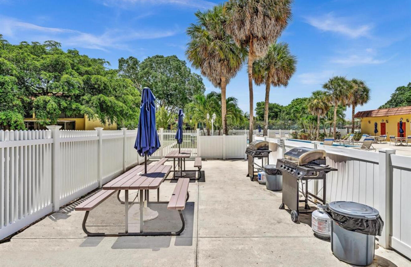 906 Southwest 9th St Circle, Unit 204 Boca Raton, FL 33486 - Photo 34 of 39 a view of a patio with iron fence