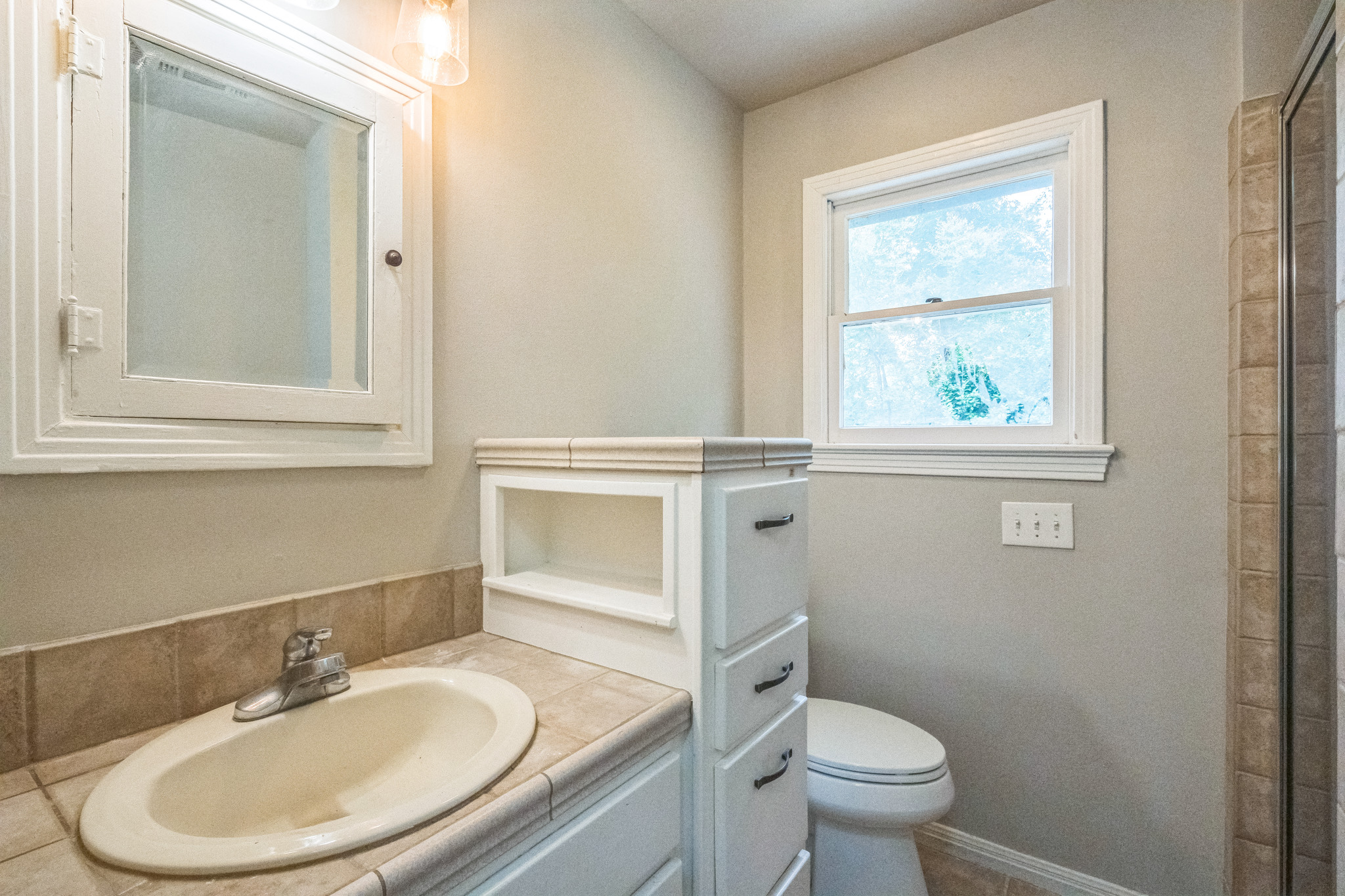 1402 Laurel Street, Unit B Georgetown, TX 78626 - Photo 11 of 21 Bathroom featuring vanity and an enclosed shower