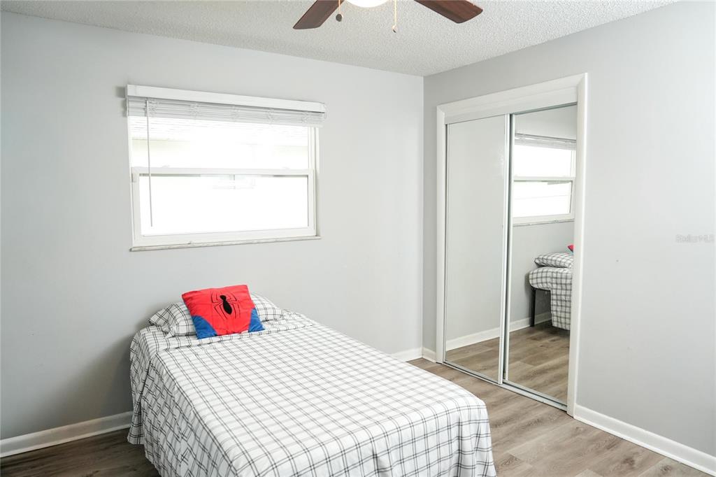 821 Barber Street Sebastian, FL 32958 - Photo 13 of 29 a bedroom with a bed and a window