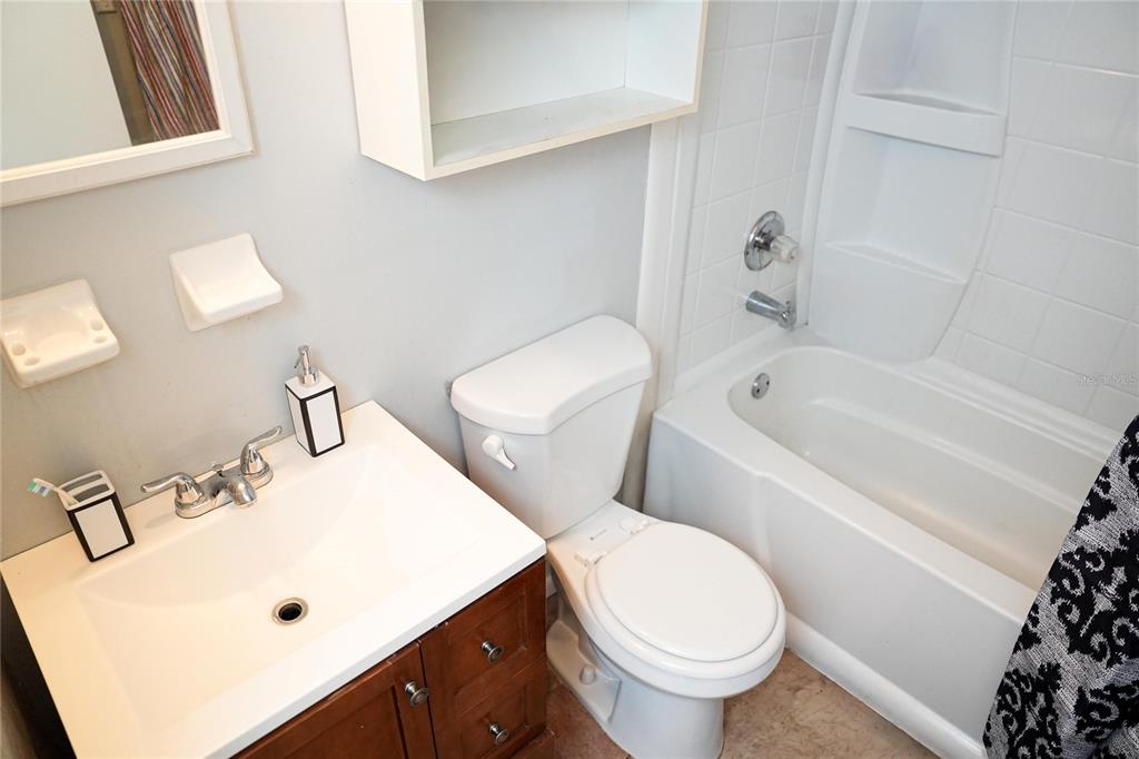 821 Barber Street Sebastian, FL 32958 - Photo 16 of 29 a white toilet sitting next to a bathroom sink