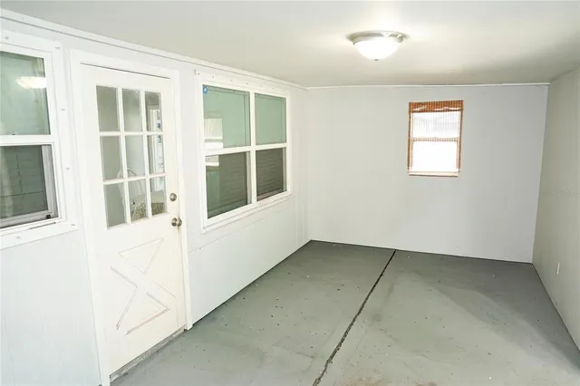 an empty room with windows