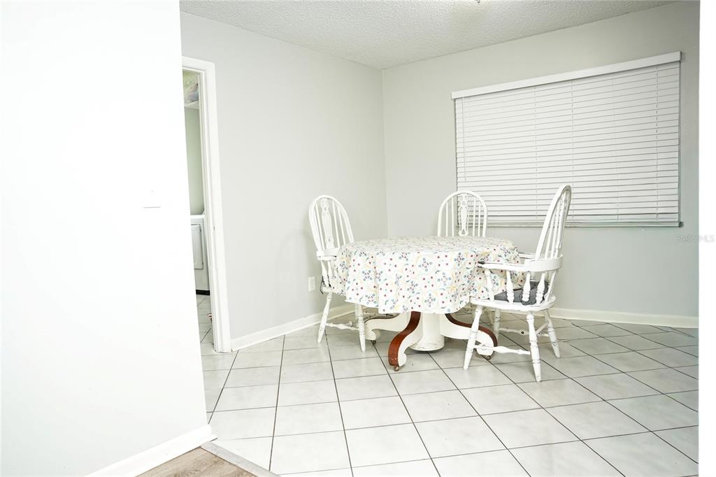 821 Barber Street Sebastian, FL 32958 - Photo 7 of 29 a dining room with furniture and a window