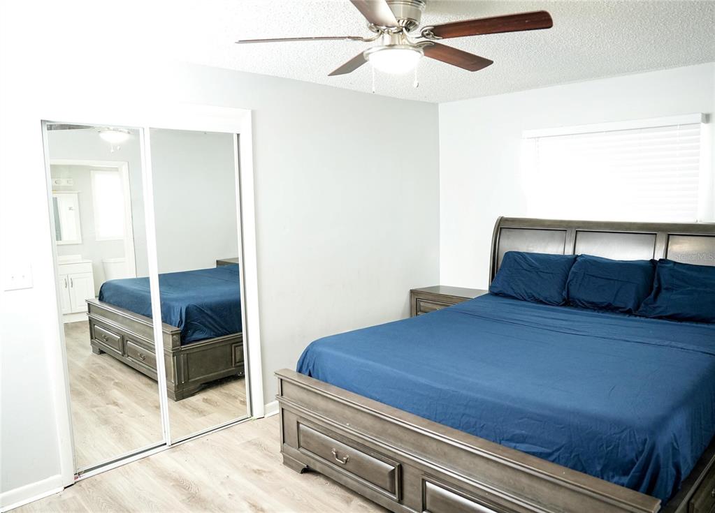 821 Barber Street Sebastian, FL 32958 - Photo 8 of 29 a bedroom with a bed and cabinet