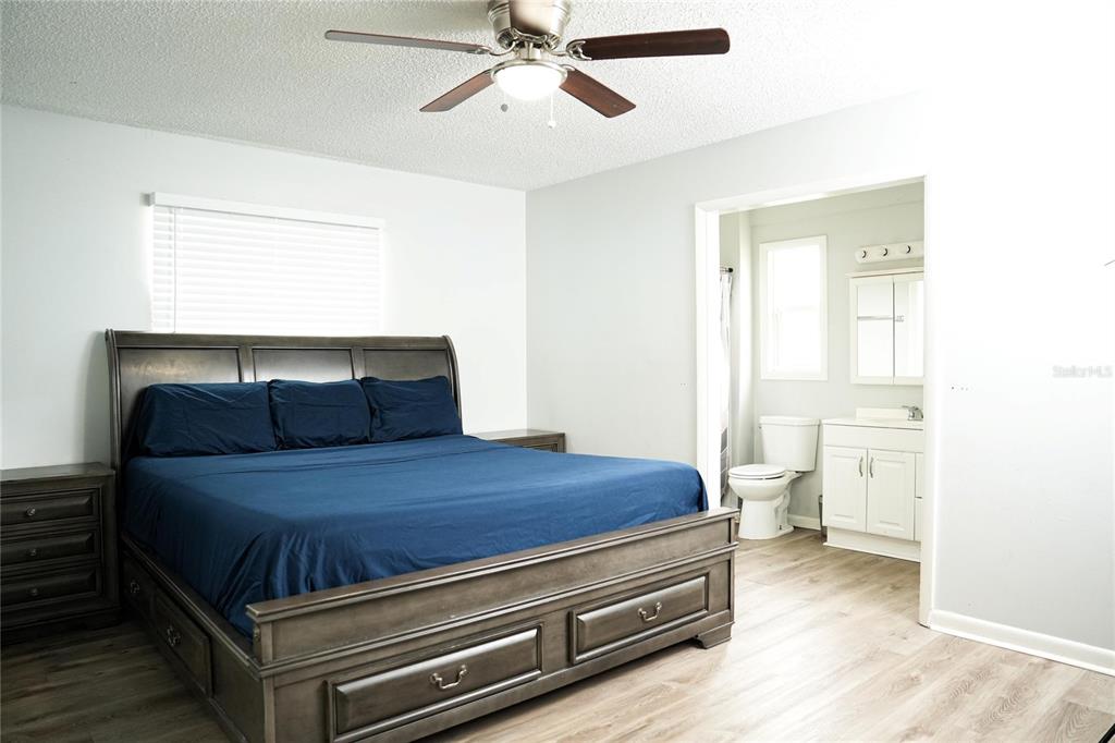 821 Barber Street Sebastian, FL 32958 - Photo 9 of 29 a bed room with a bed and window