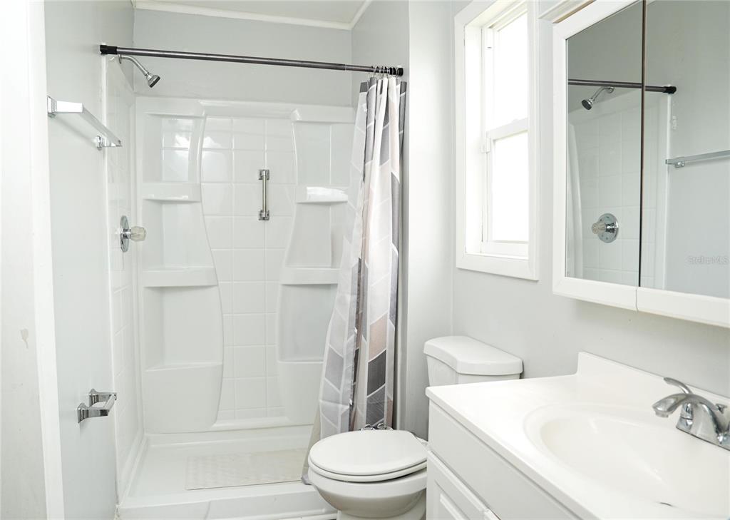 821 Barber Street Sebastian, FL 32958 - Photo 10 of 29 a bathroom with a sink toilet and shower