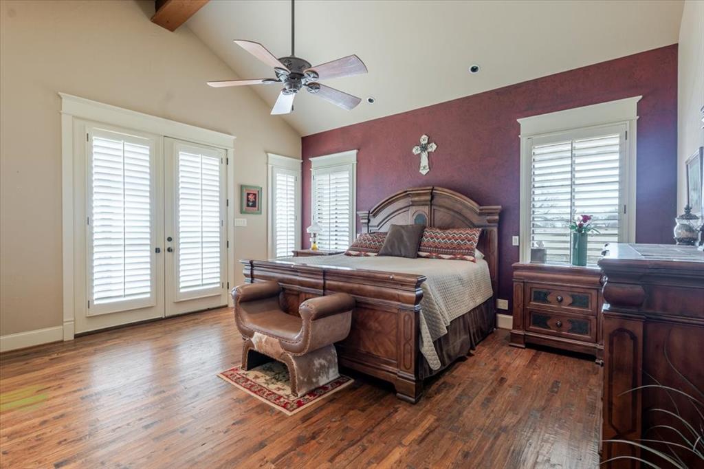 11918 Riek Road Krum, TX 76249 - Photo 18 of 40 a bedroom with a bed and wooden floor