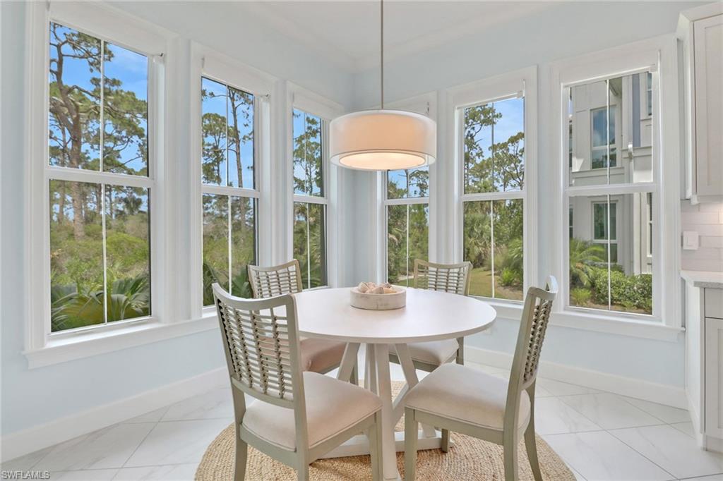 6509 Dominica Drive, Unit 101 Naples, FL 34113 - Photo 11 of 33 a view of a dining room with furniture window and outside view
